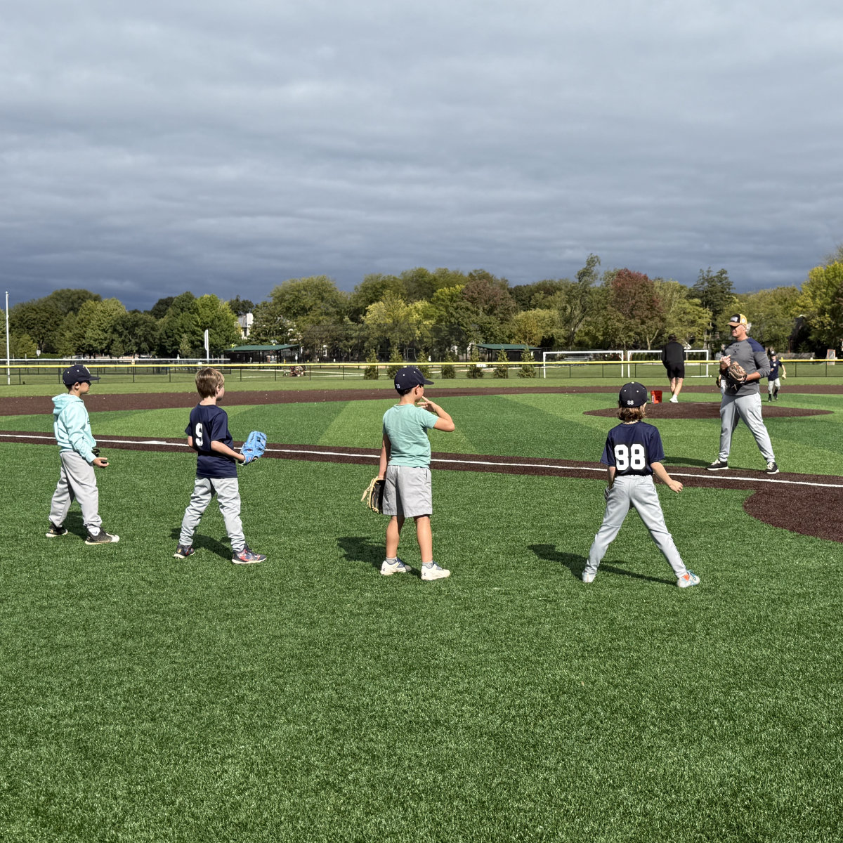 kids lined up to recieve a ground ball kids lined up to recieve a ground ball